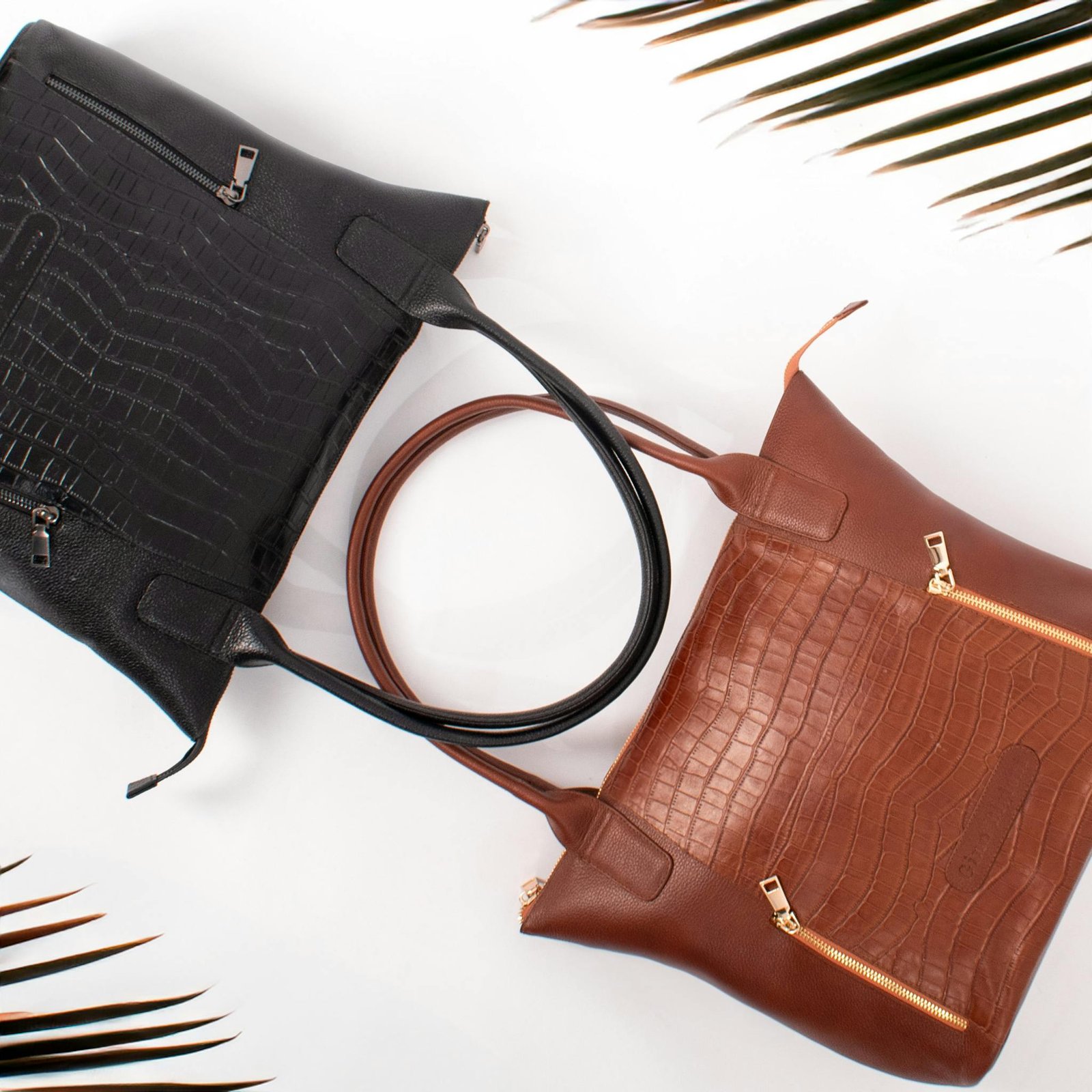 Luxury black and brown leather handbags with crocodile texture, perfect for fashion and lifestyle.